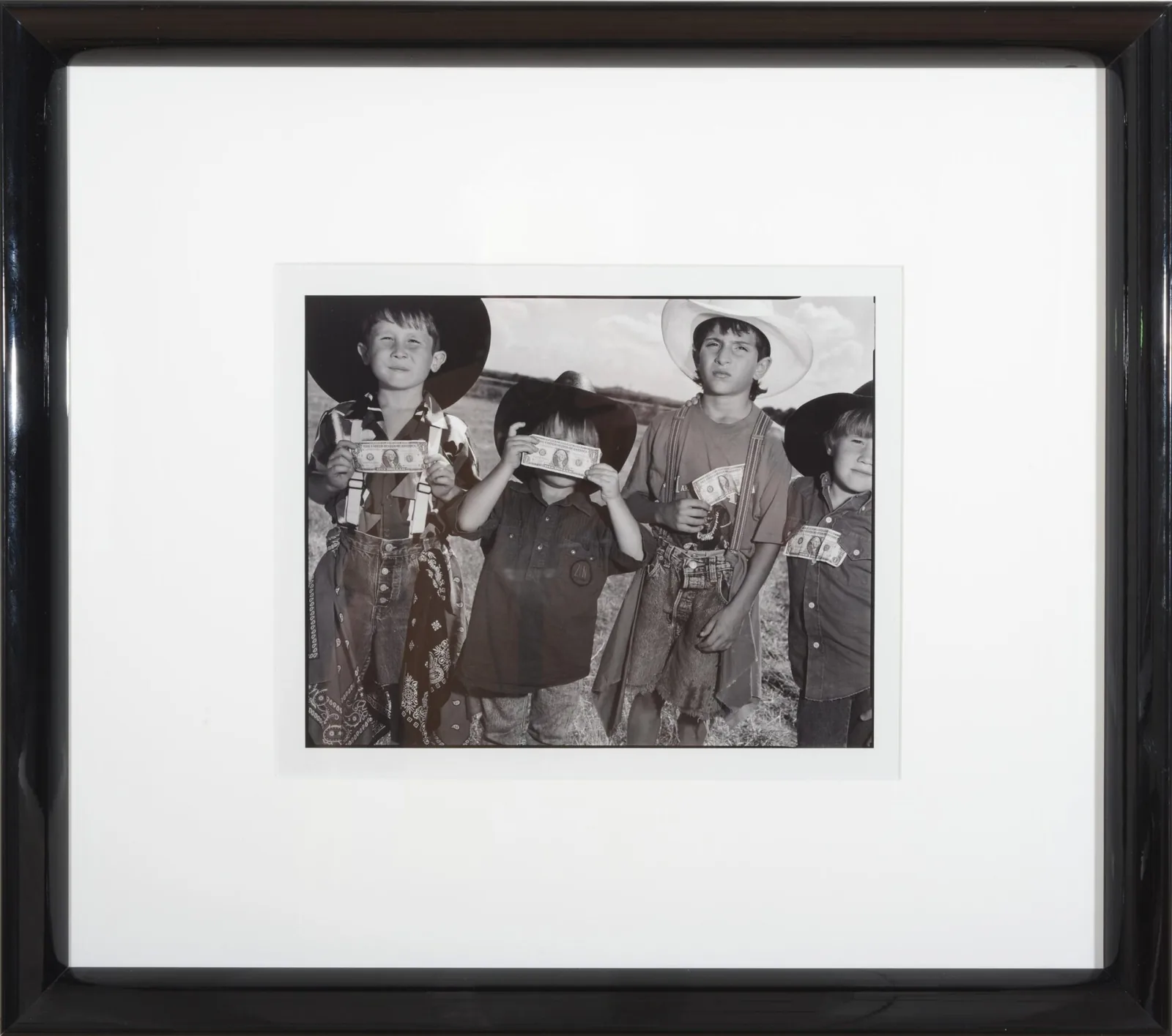 Mary Ellen Mark, Boys with Dollars, Boerne, Texas, 1991. Silver print Image: 14 x 11 inches Frame: 24 x 21 inches Edition 95 of 100 Signature, title, year & edition on back